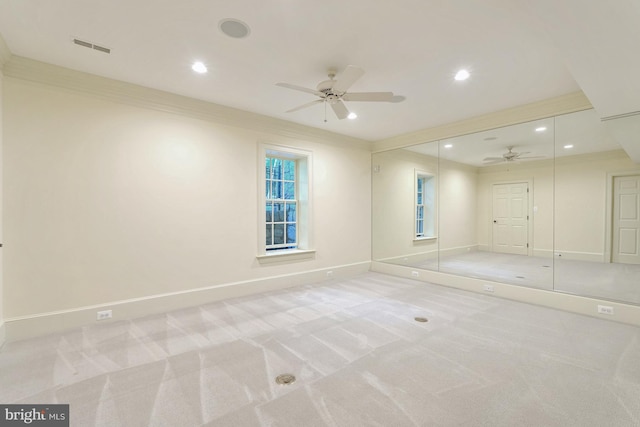 unfurnished bedroom featuring recessed lighting, baseboards, light carpet, and crown molding