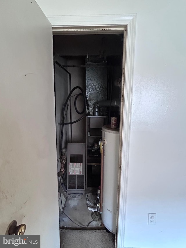 utility room featuring gas water heater