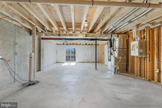 basement with heating unit and water heater