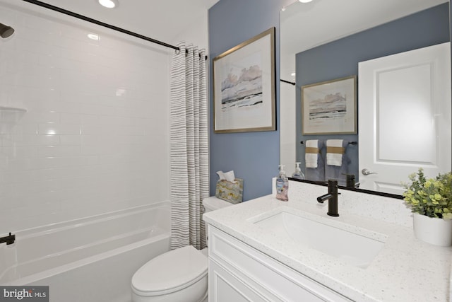 full bathroom featuring shower / bath combo with shower curtain, toilet, and vanity