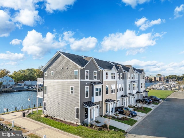 view of home's exterior with a water view