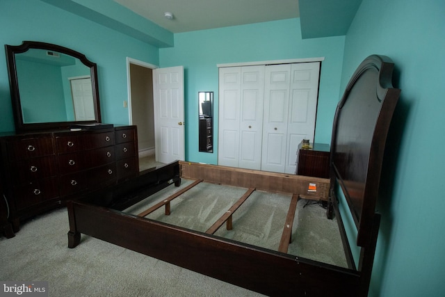 carpeted bedroom featuring a closet