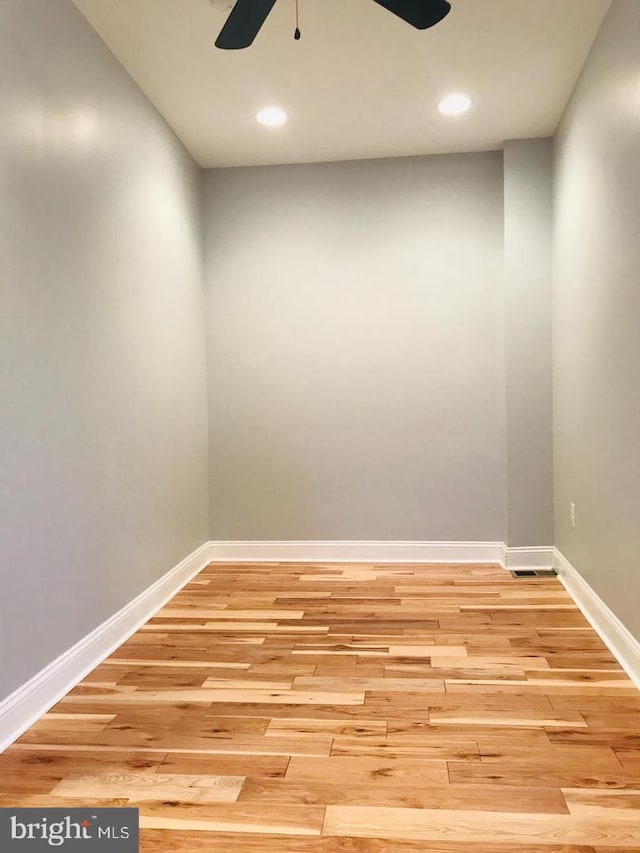 empty room featuring recessed lighting, baseboards, light wood-type flooring, and ceiling fan