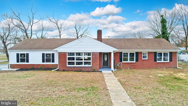 ranch-style house with a front lawn, brick siding, and a chimney