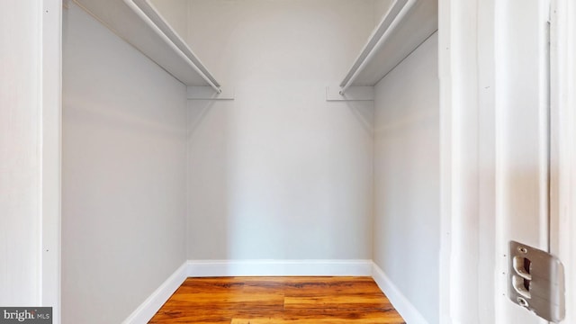 spacious closet with wood finished floors