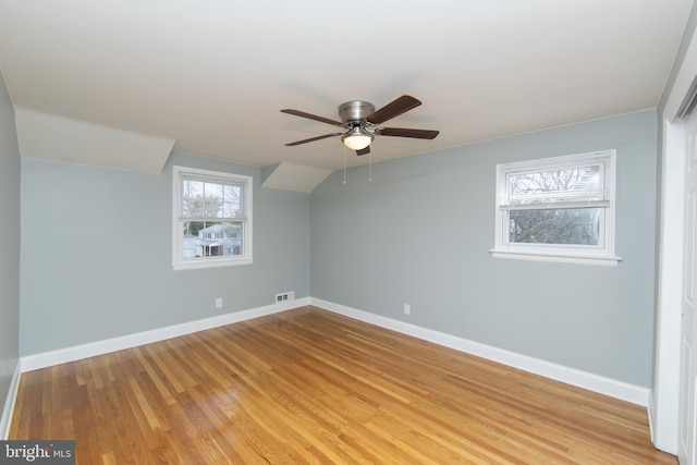 interior space with visible vents, light wood-type flooring, and baseboards