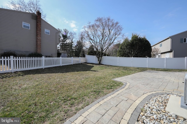 view of yard with a patio and a fenced backyard