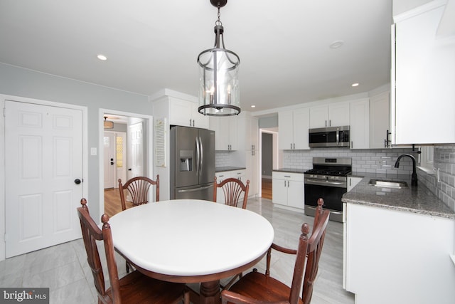 dining room featuring recessed lighting