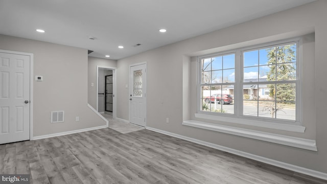 interior space with visible vents, recessed lighting, baseboards, and wood finished floors