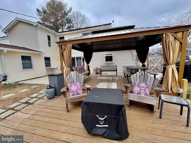 wooden deck featuring a gazebo