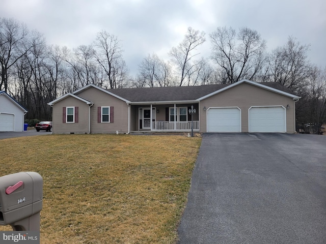 single story home with aphalt driveway, an attached garage, a porch, and a front yard