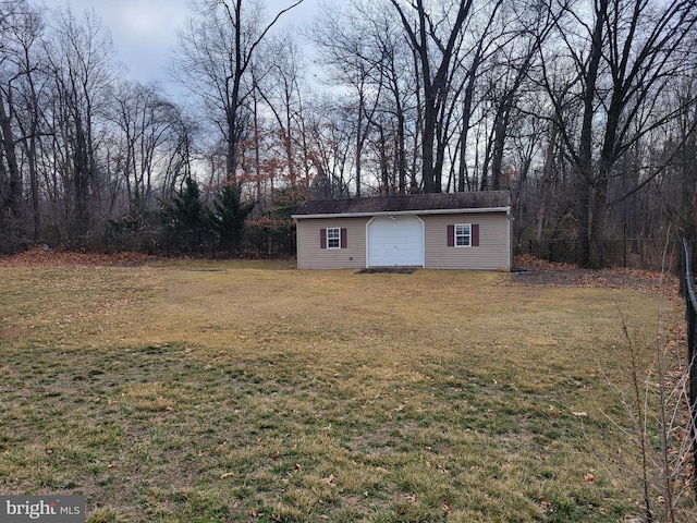 view of outbuilding featuring a garage and an outdoor structure