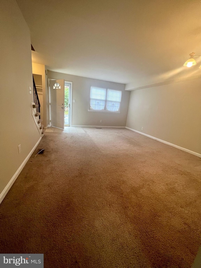 interior space featuring stairway and baseboards