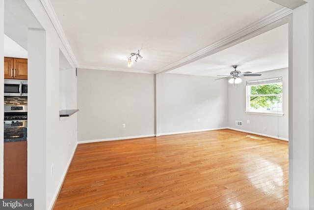 8042 Saint Annes Ct, Alexandria, VA 22309 - unfurnished room with crown molding, light wood finished floors, baseboards, and a ceiling fan