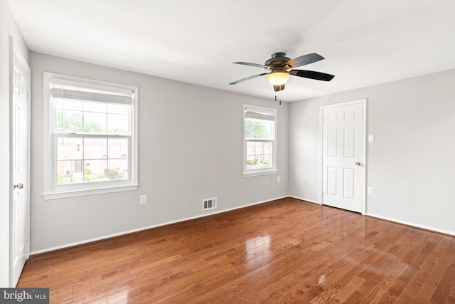8042 Saint Annes Ct, Alexandria, VA 22309 - unfurnished room featuring wood finished floors, a ceiling fan, and baseboards
