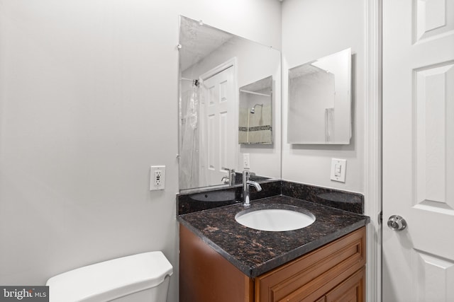 8042 Saint Annes Ct, Alexandria, VA 22309 - bathroom with toilet, vanity, and a shower