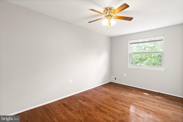 8042 Saint Annes Ct, Alexandria, VA 22309 - unfurnished room with wood finished floors, baseboards, and a ceiling fan