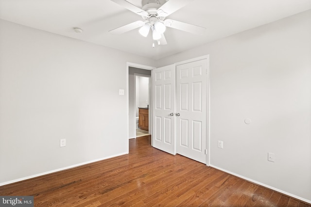 8042 Saint Annes Ct, Alexandria, VA 22309 - unfurnished bedroom with baseboards, hardwood / wood-style floors, a ceiling fan, and a closet