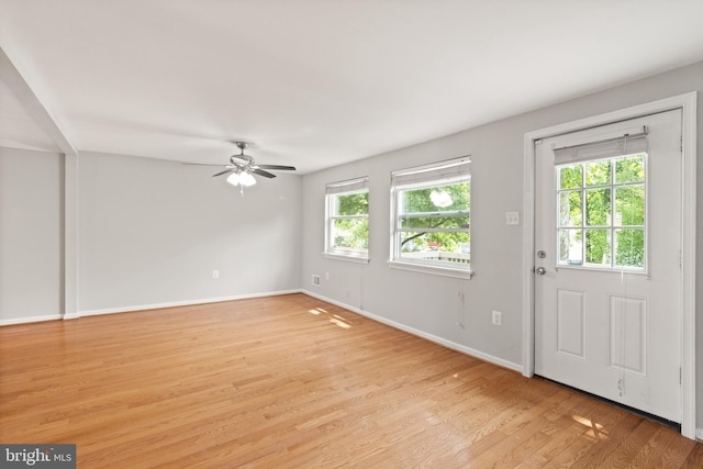 8042 Saint Annes Ct, Alexandria, VA 22309 - unfurnished living room featuring a ceiling fan, light wood-type flooring, and baseboards