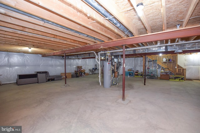 unfinished basement featuring water heater