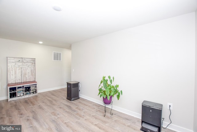 interior space featuring wood finished floors, recessed lighting, baseboards, and visible vents