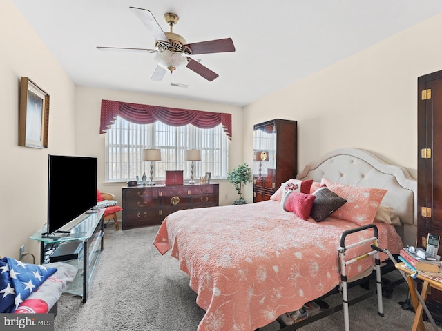 bedroom featuring visible vents, carpet flooring, and a ceiling fan