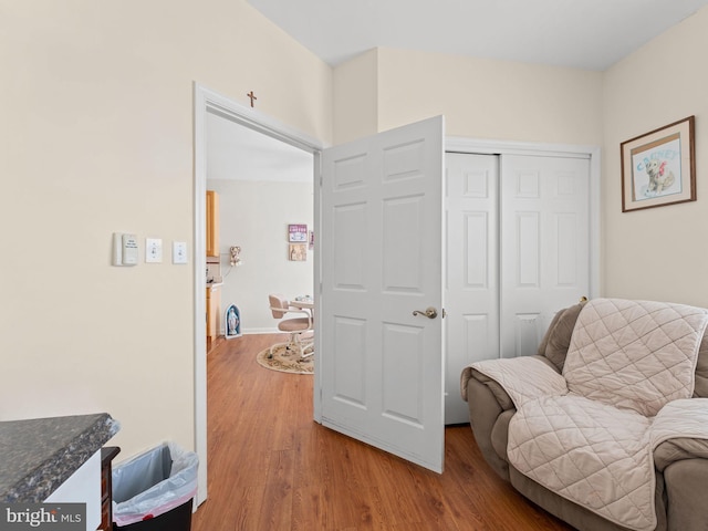 living area featuring wood finished floors and baseboards