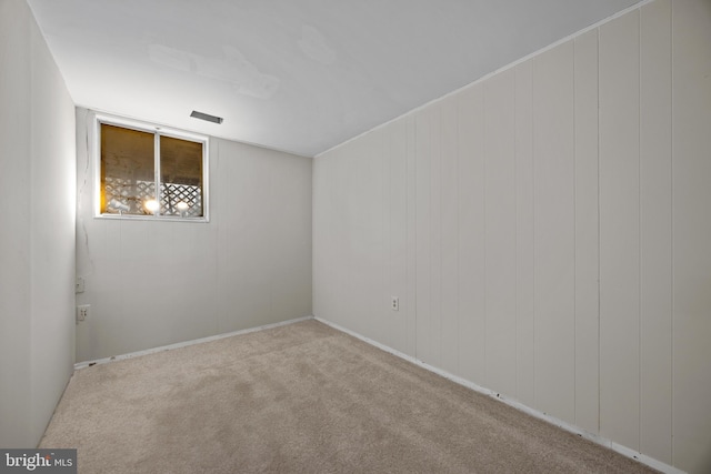 spare room featuring carpet