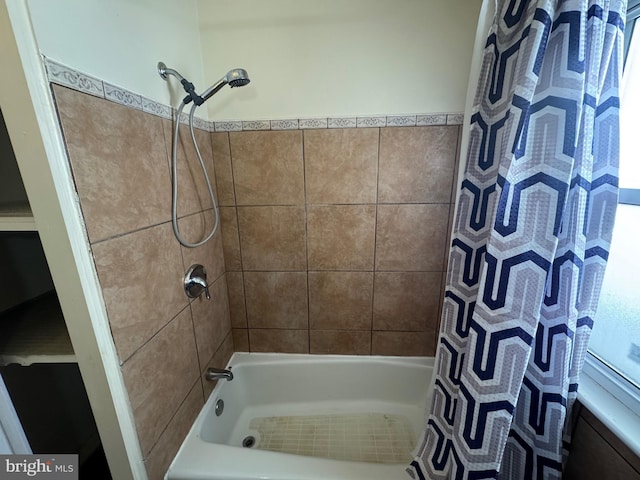 full bathroom with shower / bath combo