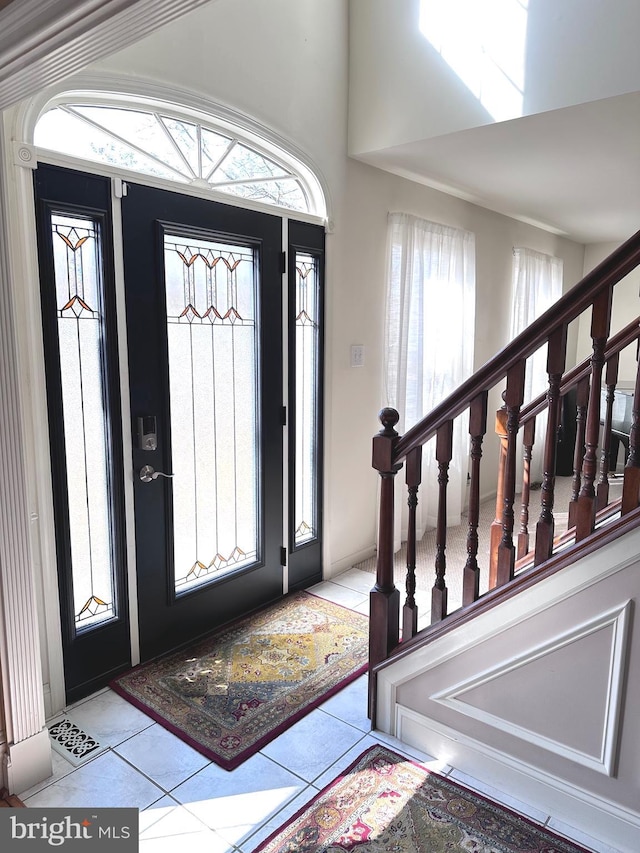 entryway featuring tile patterned flooring and visible vents