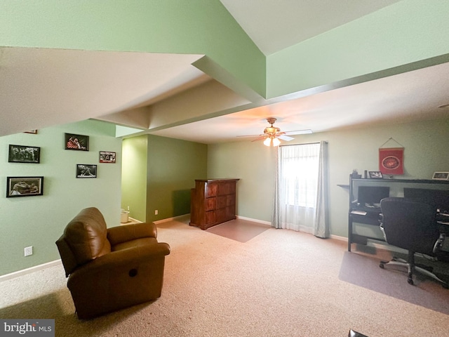 interior space featuring baseboards and ceiling fan