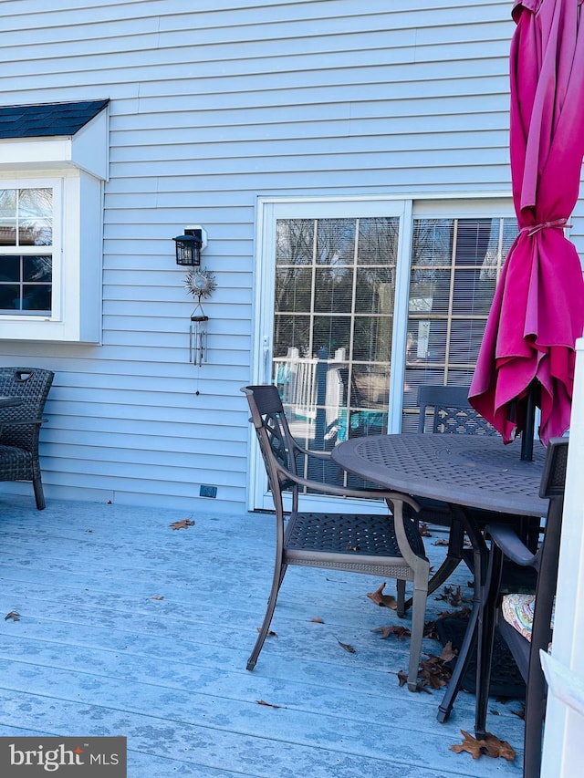 wooden deck with outdoor dining space