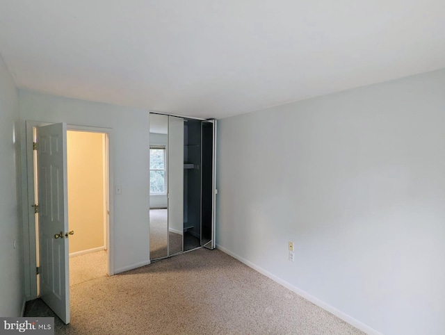 unfurnished bedroom with baseboards and carpet floors