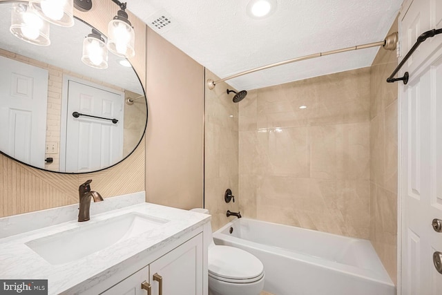 full bath featuring a textured ceiling, toilet, shower / bathtub combination, and vanity