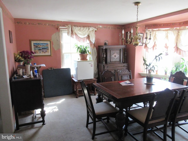 dining area with a notable chandelier