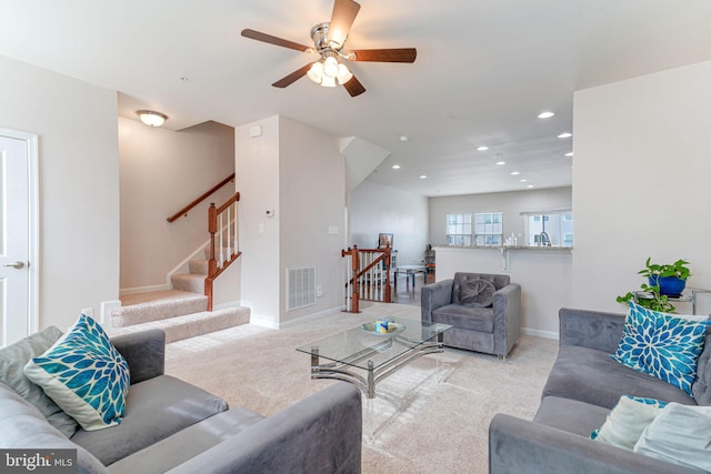 carpeted living room featuring visible vents, recessed lighting, baseboards, and ceiling fan