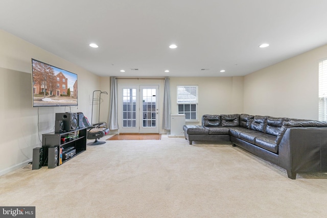 living area featuring carpet flooring, recessed lighting, and plenty of natural light