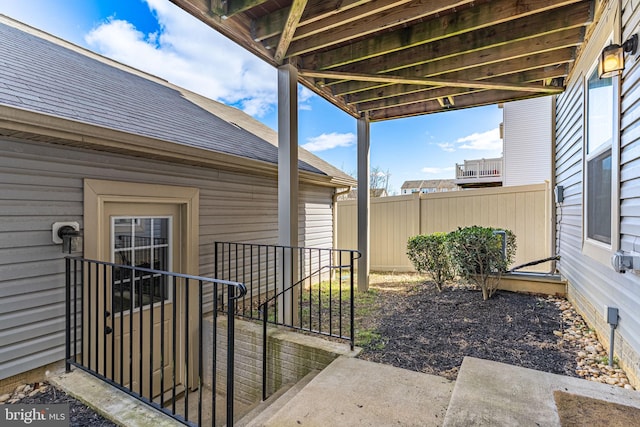 view of patio featuring fence