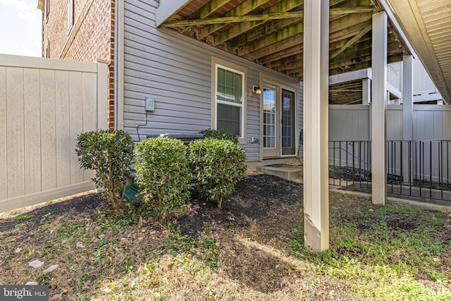 view of home's exterior with fence