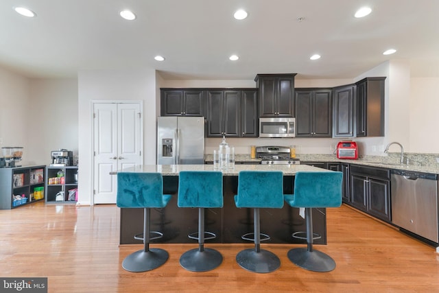 kitchen with recessed lighting, light wood-style flooring, and appliances with stainless steel finishes