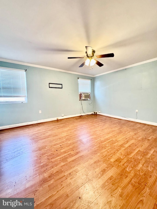 unfurnished room featuring wood finished floors, ceiling fan, crown molding, cooling unit, and baseboards