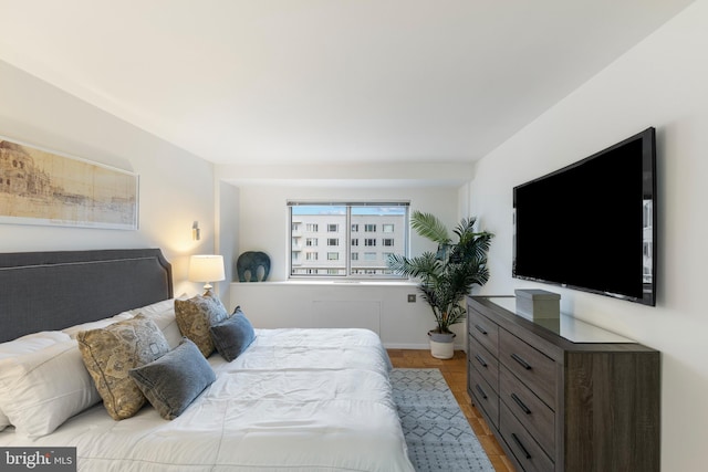 bedroom featuring wood finished floors