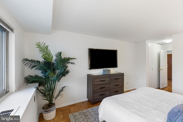 bedroom featuring baseboards