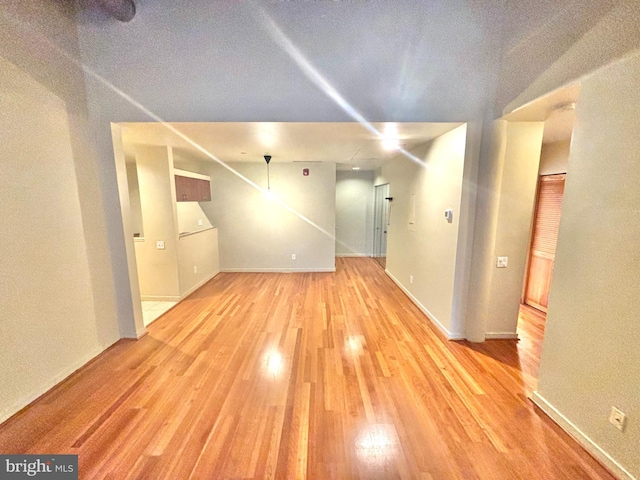 interior space with light wood-type flooring and baseboards