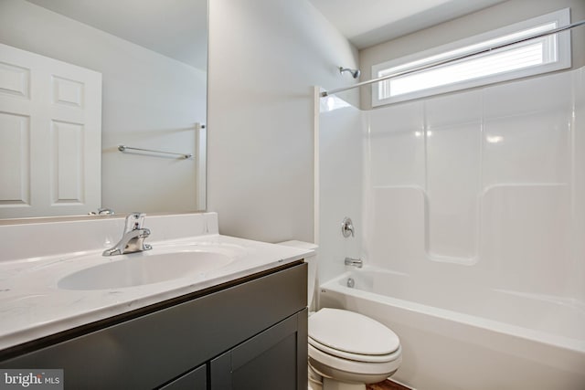 full bath with vanity, toilet, and shower / washtub combination