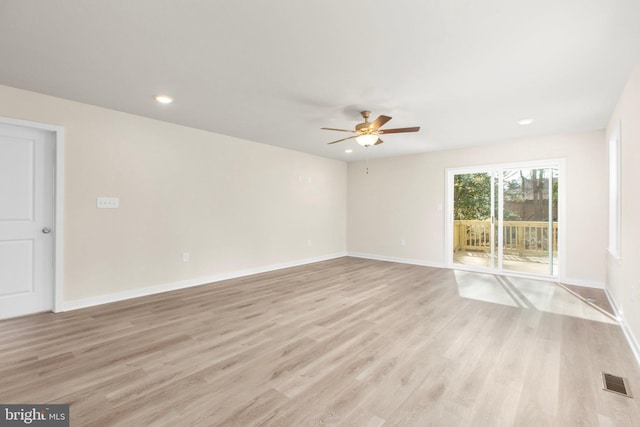 unfurnished room with a ceiling fan, visible vents, light wood finished floors, baseboards, and recessed lighting