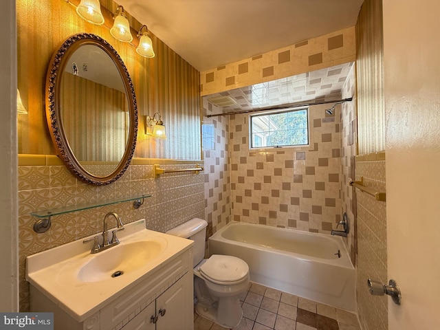 full bath with tile patterned flooring, tile walls, toilet, bathing tub / shower combination, and vanity