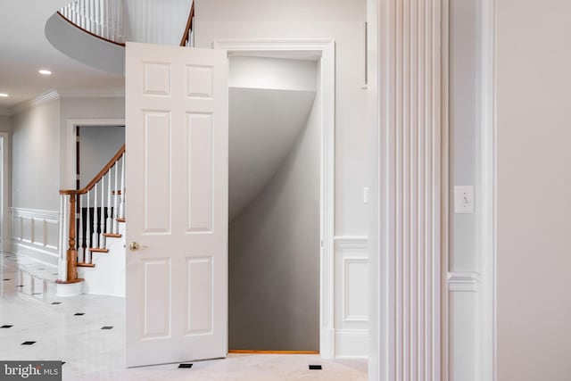 staircase with recessed lighting and ornamental molding