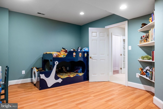 playroom featuring recessed lighting, wood finished floors, visible vents, and baseboards