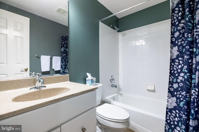 full bathroom featuring vanity, toilet, shower / bath combo, and visible vents